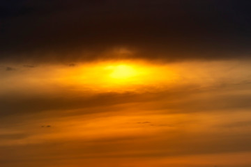 Fiery orange sunset sky. Beautiful sky with clouds.
