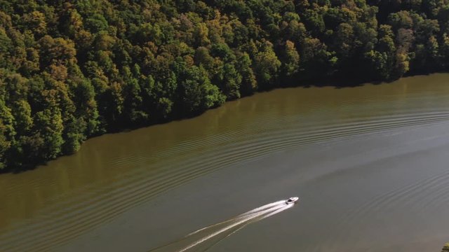 Aerial tracking shot of a motorboat in Raystown lake, Pennsylvania.
