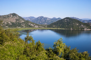 Fototapeta na wymiar View of the summer seascape Montenegro in Balkans. Mountains,sea and islands.