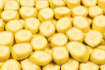 Fresh banana slices background. Top view.