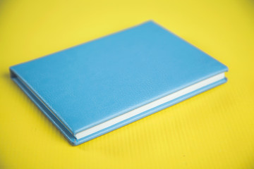 notepad on yellow desk