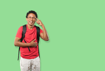 Happy young man doing a gesture of concentration