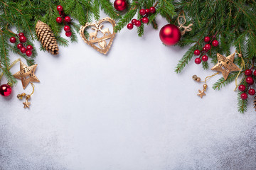 Christmas background with fir tree, red and gold gifts. Top view Copy space