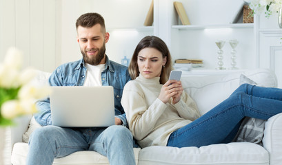 Distrust in relationships. Wife spying at man's laptop