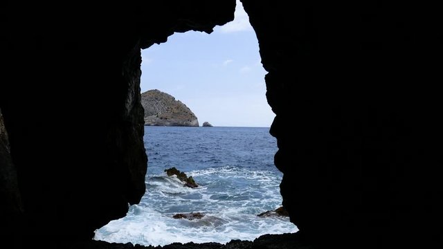 holes in the rock with the sea in the background in the cave of Minerva in the protected marine natural area of Punta Campanella. Sorrento Peninsula, Campania, Naples, Italy