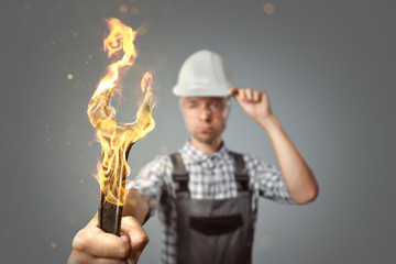 Craftsman with a burning wrench tool