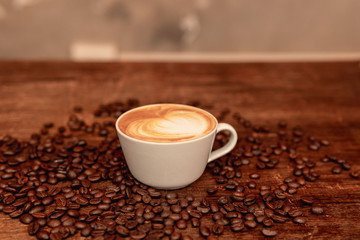 Barista in coffee shop preparing a cappuccino