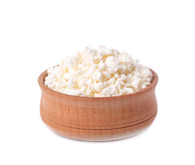 Cottage cheese in a wooden bowl isolated on a white background.