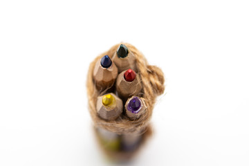 Colored pencils for children. Natural wood material on a white background. Pencils for drawing.