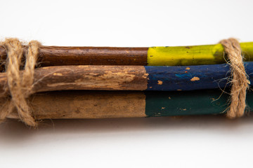 Colored pencils for children. Natural wood material on a white background. Pencils for drawing.
