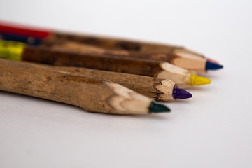 Obraz premium Colored pencils for children. Natural wood material on a white background. Pencils for drawing.