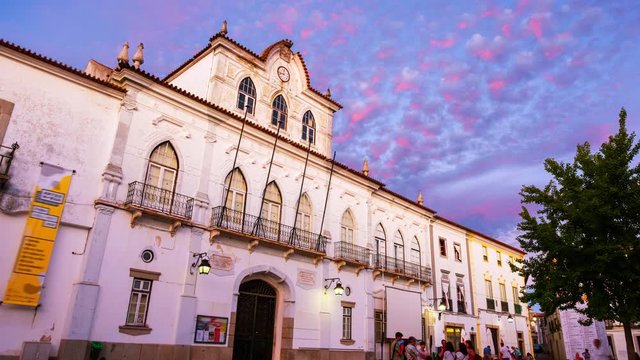 Evora, Portugal. View of the Town Hall in Evora, Portugal during the sunset. Beautiful landmark with colorful sky in summer. Time-lapse in the evening, panning video