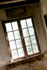 Beautiful wooden frame window in old building without people