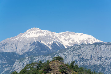 The snowy top of the mountain. Photo taken in the area of Tekirova, Antalya Turkey