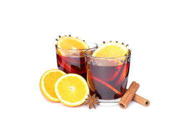 Glasses of tasty mulled wine with orange isolated on white background