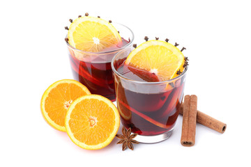 Glasses of tasty mulled wine with orange isolated on white background