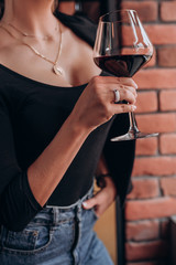 woman with glass of red wine