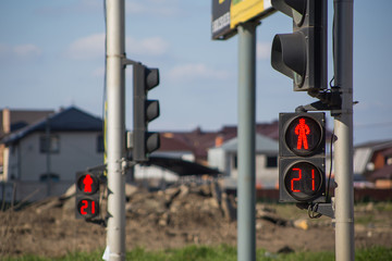 Close-up red traffic light in the city street, on pedestrian red traffic light number 21 on dial