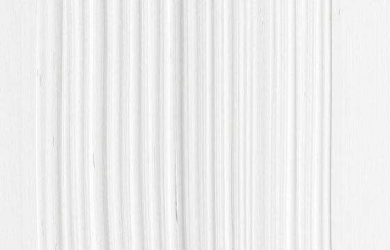 The texture of white marble of packaging in a modern style. Beautiful drawing with the divorces and wavy lines in gray tones for wallpapers and screensaver.