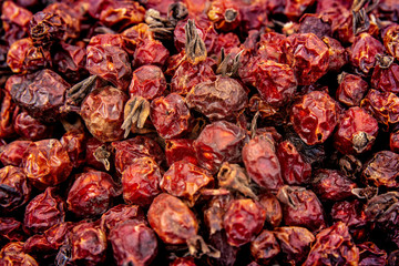 Dry berry Rose hips background. Dried rose hips. Pile of dogrose. Healfy concept