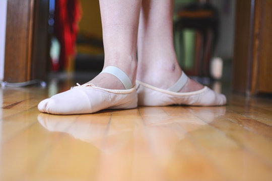 Close-up photos taken of Ballet Starting Position. Beginning of the adult ballet recreational class.Legs with shoes for pre-ballet classes for adult ballet beginners. 