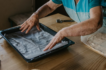 woman hand preparing tray for desserts or baked food