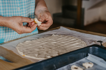 hands cooking making donuts or traditional sweets