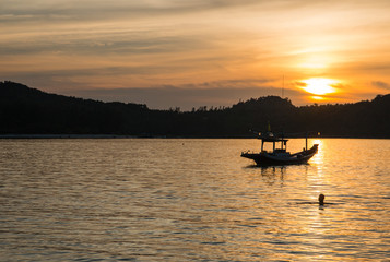 Fishermen boat at sunset near Koh Phangan island, Thailand