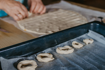 hands cooking making donuts or traditional sweets
