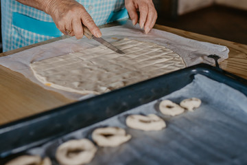 hands cooking making donuts or traditional sweets