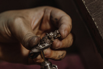 Jeweler working at workshop