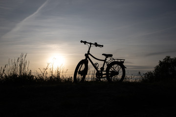 Fototapeta na wymiar silhouette of bike on sunset, Bornholm