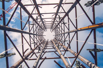 Metal frame for pouring concrete. The construction of the reinforced concrete frame of the building.