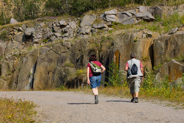 hiking in the mountains, woman and man wanderer, Vang Granitbrud, Bornholm