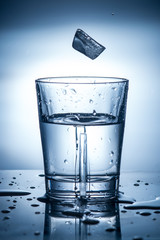 splashing clean water in a glass