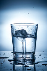 splashing clean water in a glass
