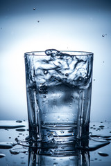 splashing clean water in a glass
