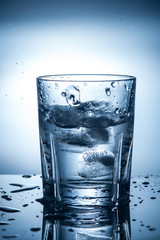 splashing clean water in a glass