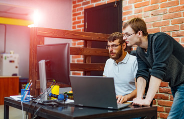 Software engineers working on project and programming in company. Website design. Brainstorming...