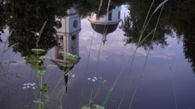 reflection of a temple in a river or lake. slow motion 50p