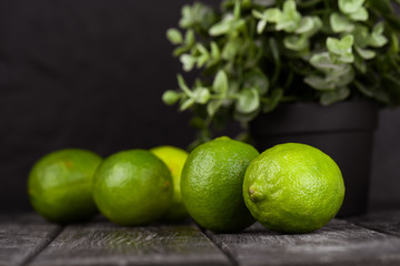 lime juice with lime slices on wooden table. Detox diet