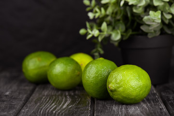 lime juice with lime slices on wooden table. Detox diet