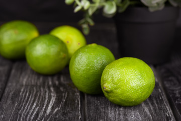 lime juice with lime slices on wooden table. Detox diet