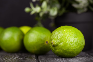 lime juice with lime slices on wooden table. Detox diet