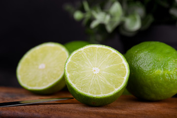 lime juice with lime slices on wooden table. Detox diet