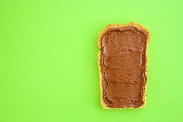 chocolate butter sandwich (delicious snack, bread or toast and nut butter, paste, classic combination of taste, Italian cuisine) menu concept. food background. copy space. Top view
