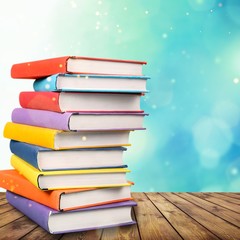 Stack books on wooden desk table