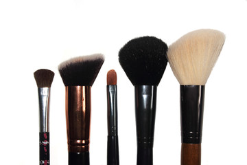 makeup brushes on a white background