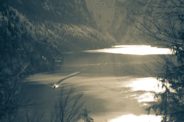 Lake Koenigsee in winter with a boat