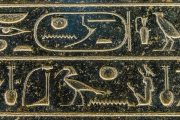 Egyptian ancient hieroglyphs on the stone wall
